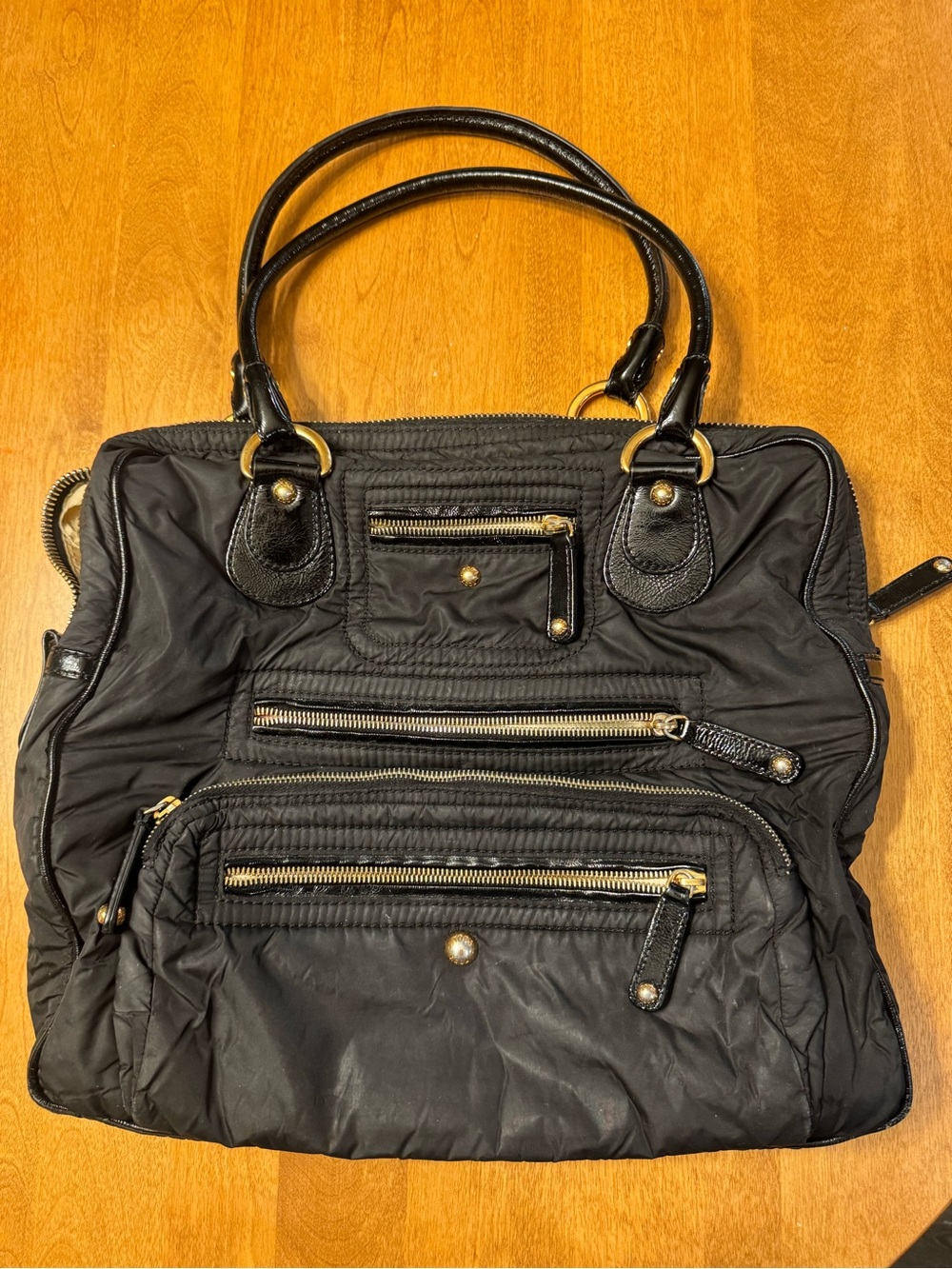 Tod's Black Shoulder Bag with Gold Hardware